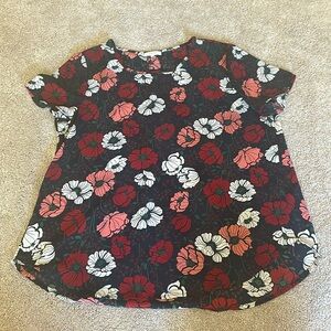 Short sleeve work blouse. Black with tan, pink, and red flowers.